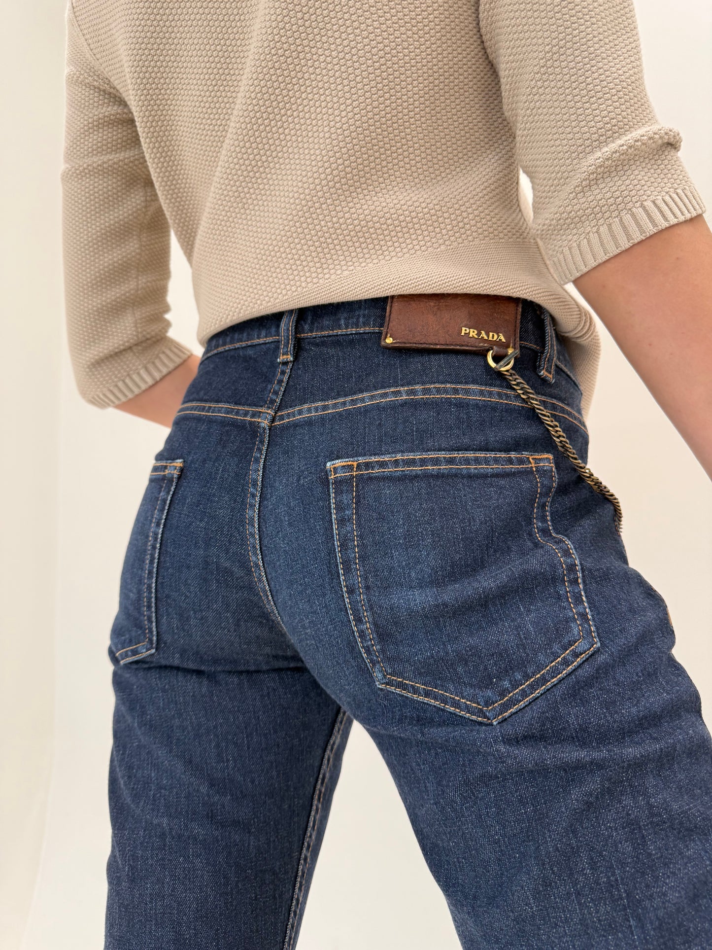 Jeans tall Prada dark wash cu decorațiune metalică detașabilă