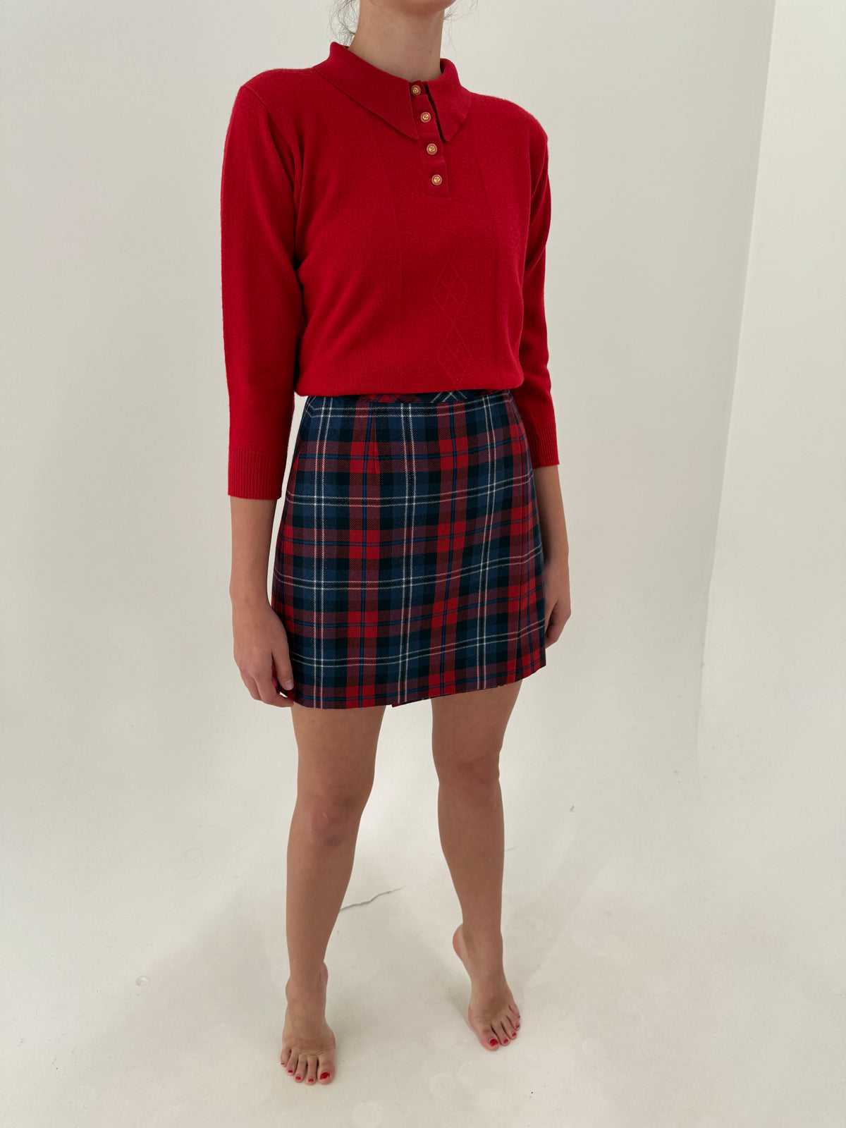 Fustă mini din tartan de lana în combinație clasică de culori tari