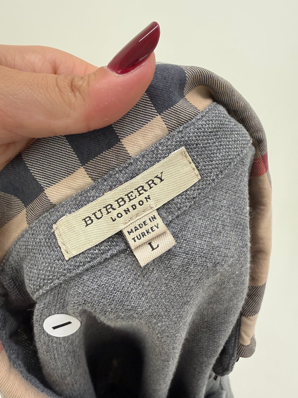 Bluză Burberry polo din bumbac gros pique și print specific brandului